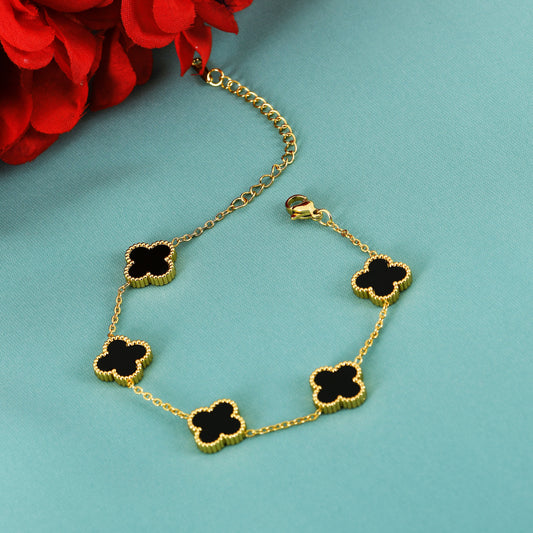 Gold Black Clover Charm Bracelet – one of the most unique bracelets for women seeking standout design and luxury