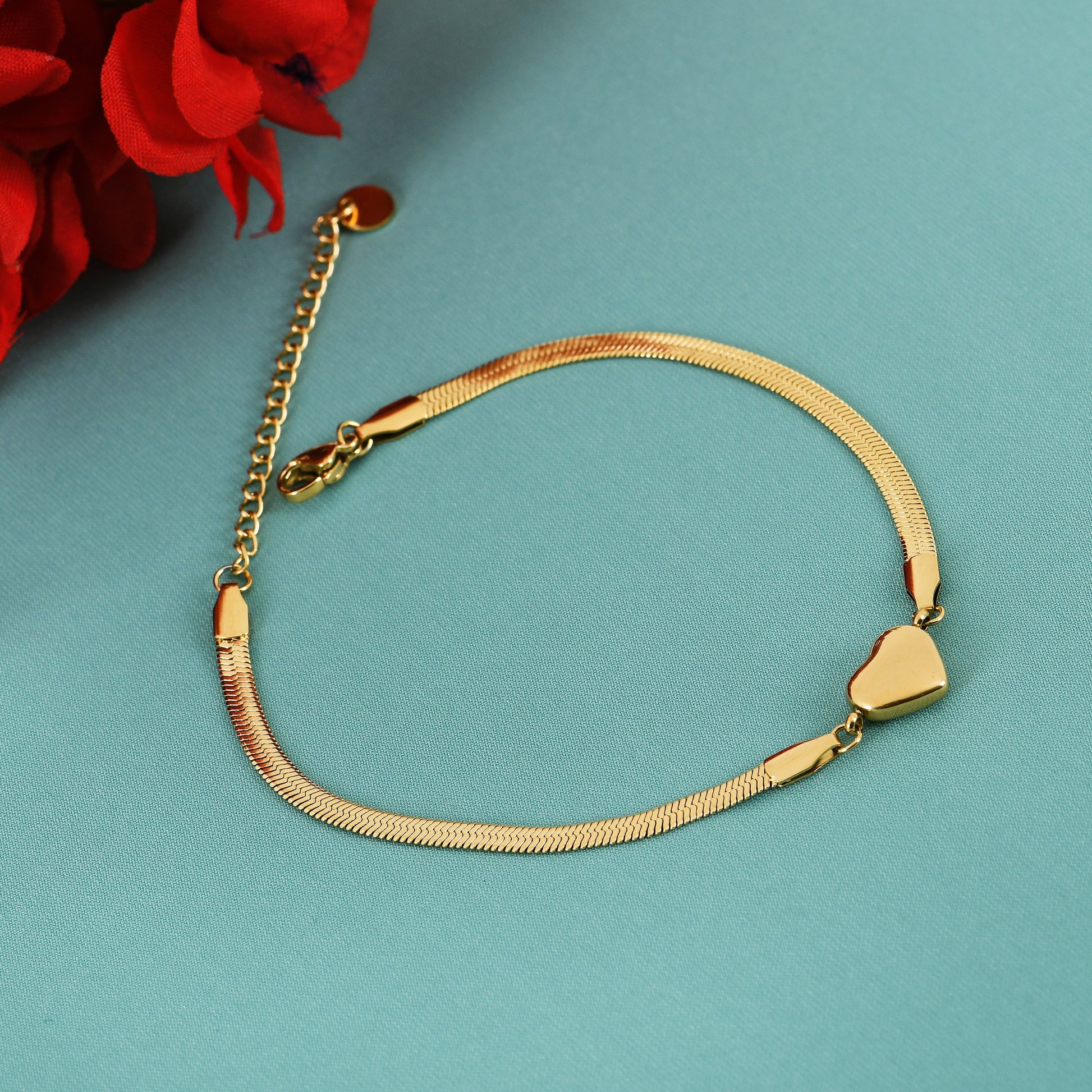 Golden Heart Charm gold bracelet for women featuring a bold heart charm and smooth chain