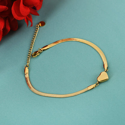 Golden Heart Charm gold bracelet for women featuring a bold heart charm and smooth chain
